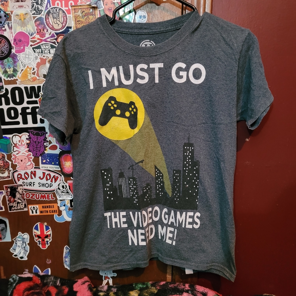 I Must Go The Video Games Need Me Tee